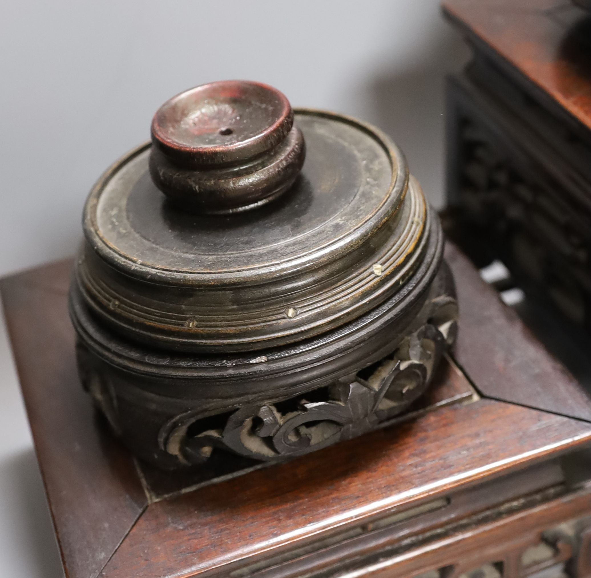 A Chinese carved hardwood 3 tier stand, late Qing, together with other similar stands. Largest 49cm
